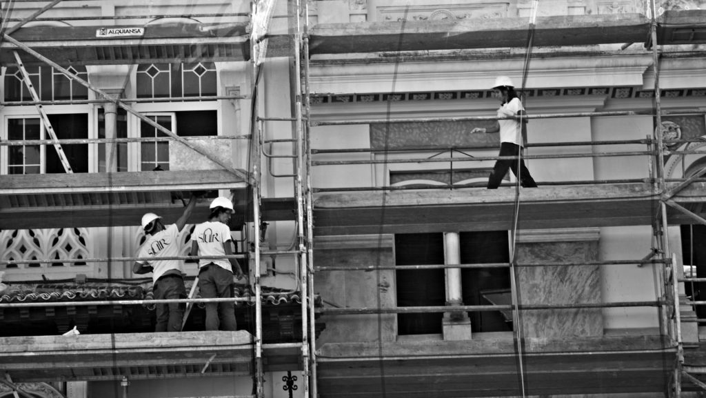 a group of men on a building